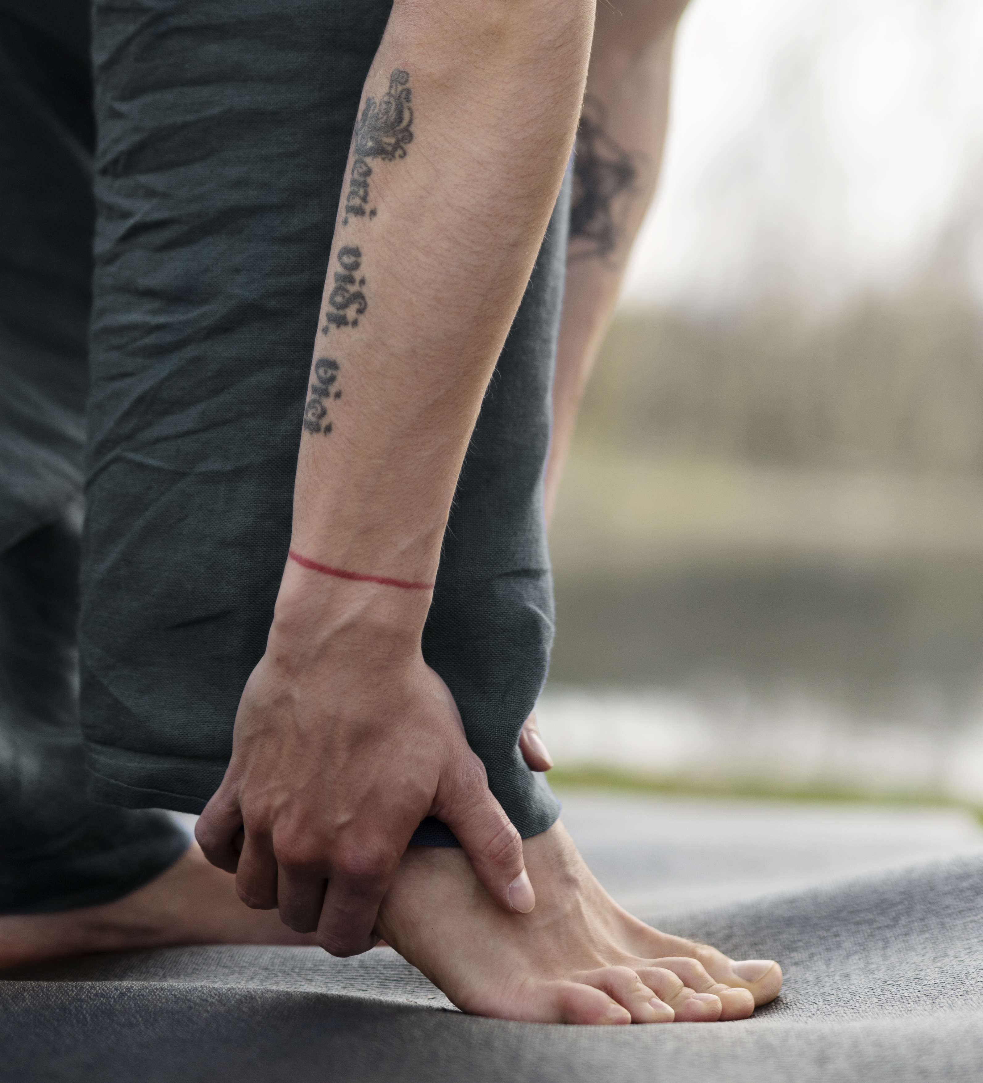 Image of man rubbing the scar on his foot.